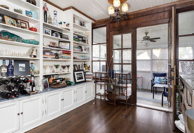 interior space featuring ceiling fan and dark wood finished floors