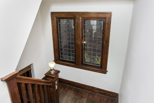 staircase featuring wood finished floors