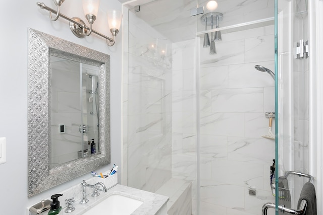 bathroom featuring a sink and a shower stall