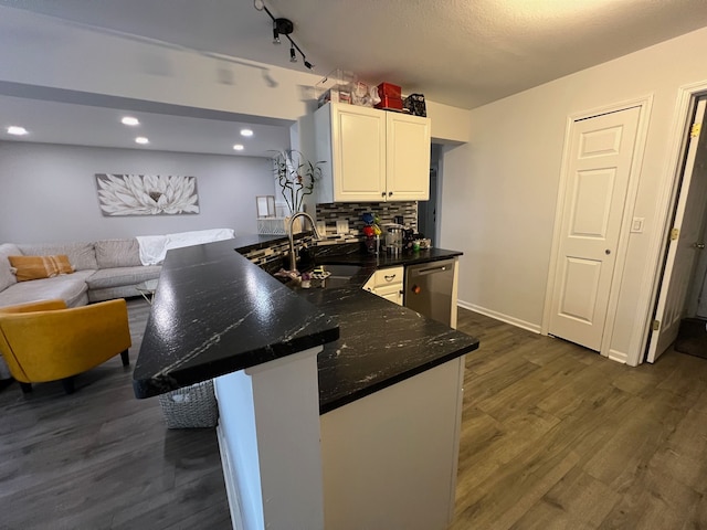 6367 Sheppard Dr, Westland, MI 48185 - kitchen featuring a peninsula, a sink, dark wood finished floors, white cabinetry, and dishwasher