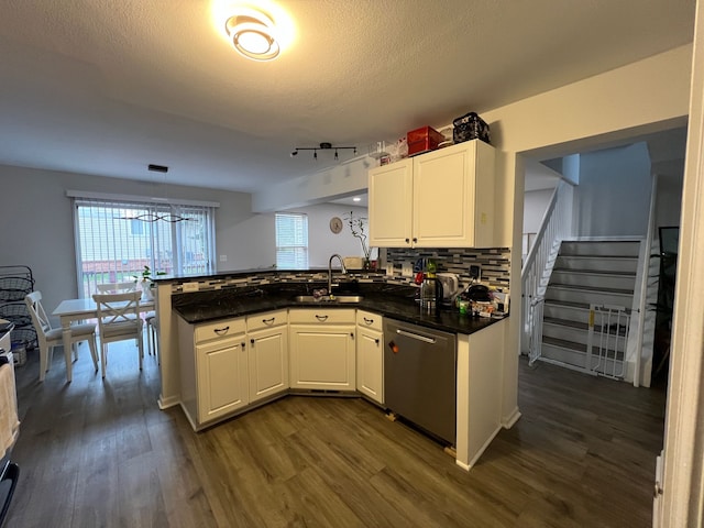 6367 Sheppard Dr, Westland, MI 48185 - kitchen featuring a peninsula, backsplash, dark wood-type flooring, and dishwasher