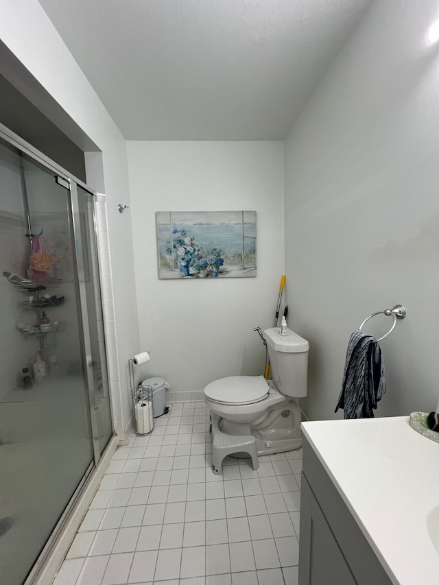 6367 Sheppard Dr, Westland, MI 48185 - full bathroom with toilet, vanity, tile patterned floors, a shower stall, and baseboards