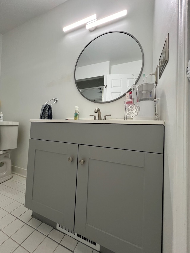 6367 Sheppard Dr, Westland, MI 48185 - bathroom with tile patterned floors, toilet, baseboards, and vanity