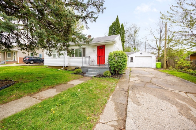 137 W Sheffield Ave, Pontiac, MI 48340 - view of front of home with an outdoor structure, concrete driveway, a garage, a front lawn, and a chimney