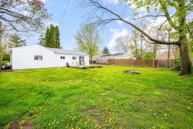 137 W Sheffield Ave, Pontiac, MI 48340 - view of yard with an outdoor fire pit, a deck, and a fenced backyard