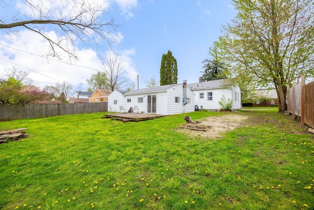137 W Sheffield Ave, Pontiac, MI 48340 - rear view of property featuring a yard, a wooden deck, and a fenced backyard