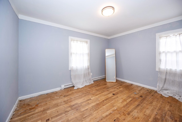 137 W Sheffield Ave, Pontiac, MI 48340 - empty room with ornamental molding, baseboards, baseboard heating, and wood finished floors