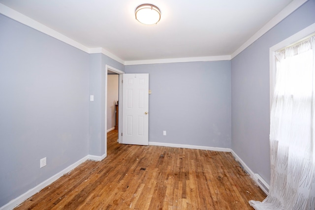 137 W Sheffield Ave, Pontiac, MI 48340 - unfurnished room with baseboards, crown molding, and wood-type flooring