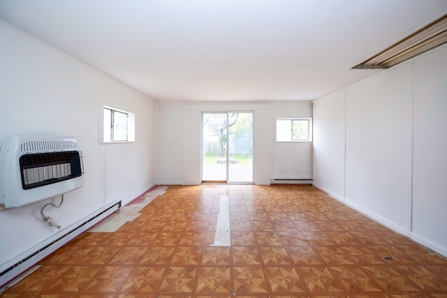 137 W Sheffield Ave, Pontiac, MI 48340 - unfurnished living room featuring heating unit, a healthy amount of sunlight, and a baseboard heating unit