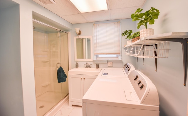 full bathroom with visible vents, washer and clothes dryer, a stall shower, and vanity