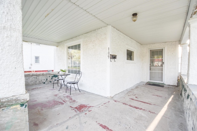 view of patio featuring a porch