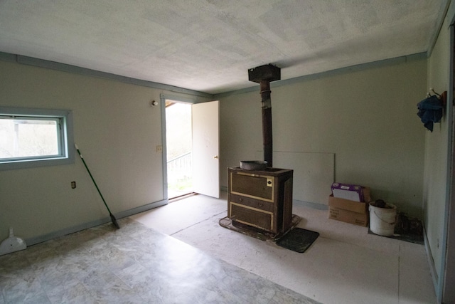 18426 14 Mile Rd, Leroy, MI 49655 - unfurnished living room with a wood stove