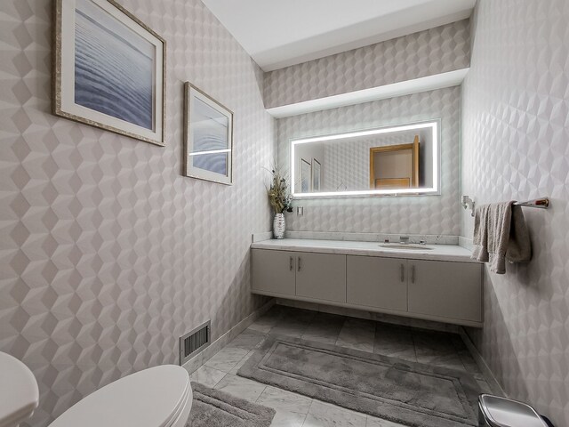 17477 Iris Cir, Clinton Township, MI 48036 - half bathroom with toilet, wallpapered walls, and vanity