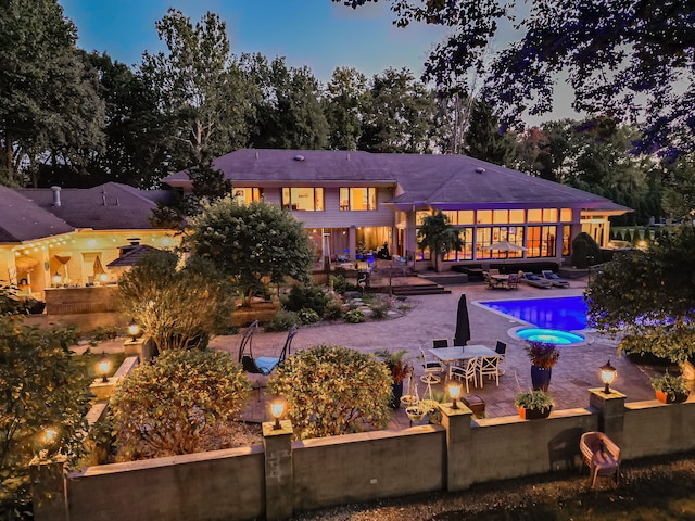 17477 Iris Cir, Clinton Township, MI 48036 - back of house with a patio area, outdoor lounge area, an outdoor pool, outdoor dining space, and fence