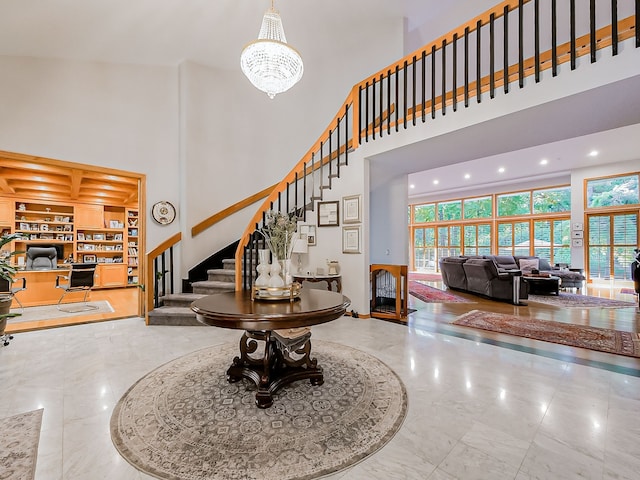 17477 Iris Cir, Clinton Township, MI 48036 - foyer featuring a towering ceiling, stairs, a chandelier, and recessed lighting