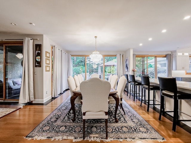 17477 Iris Cir, Clinton Township, MI 48036 - dining area featuring a chandelier, light wood finished floors, recessed lighting, and baseboards