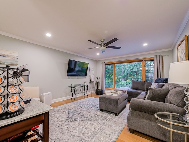 17477 Iris Cir, Clinton Township, MI 48036 - living area featuring wood finished floors, crown molding, a ceiling fan, recessed lighting, and baseboards