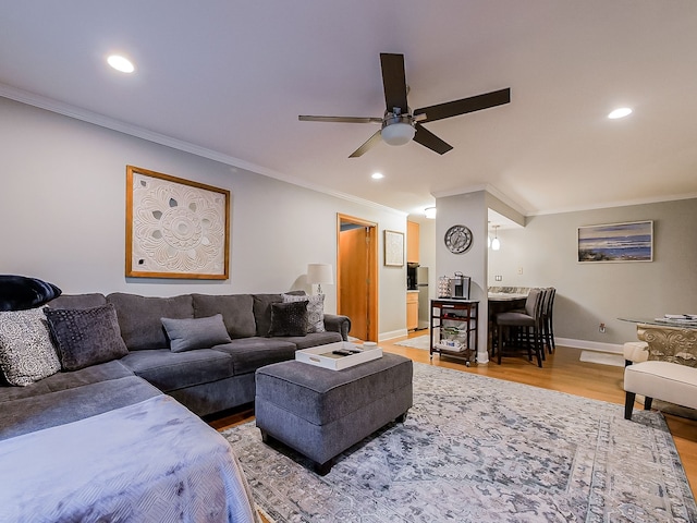 17477 Iris Cir, Clinton Township, MI 48036 - living room with ornamental molding, a ceiling fan, light wood-style flooring, baseboards, and recessed lighting