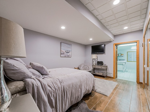 17477 Iris Cir, Clinton Township, MI 48036 - bedroom with wood finish floors, recessed lighting, ensuite bathroom, and baseboards