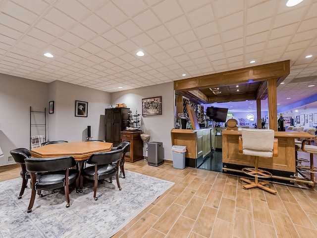 17477 Iris Cir, Clinton Township, MI 48036 - dining area featuring a dry bar, light wood-style flooring, recessed lighting, and baseboards