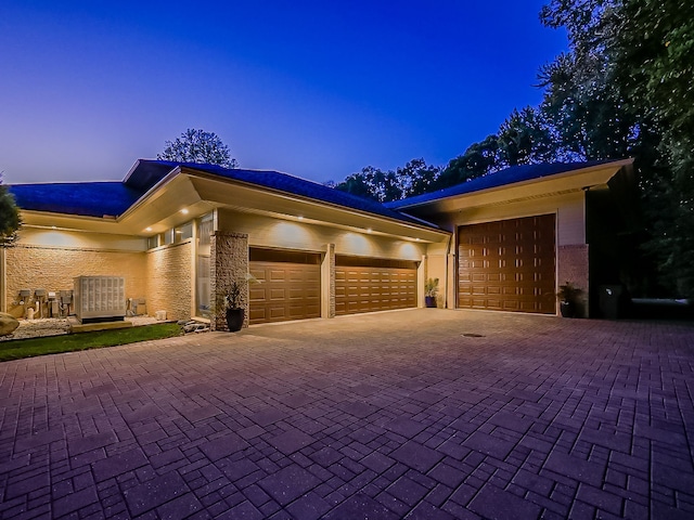 17477 Iris Cir, Clinton Township, MI 48036 - view of front of home featuring a garage and decorative driveway