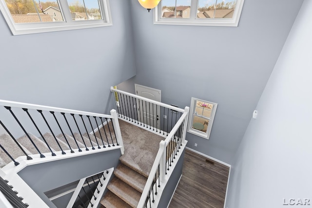 stairs with wood finished floors