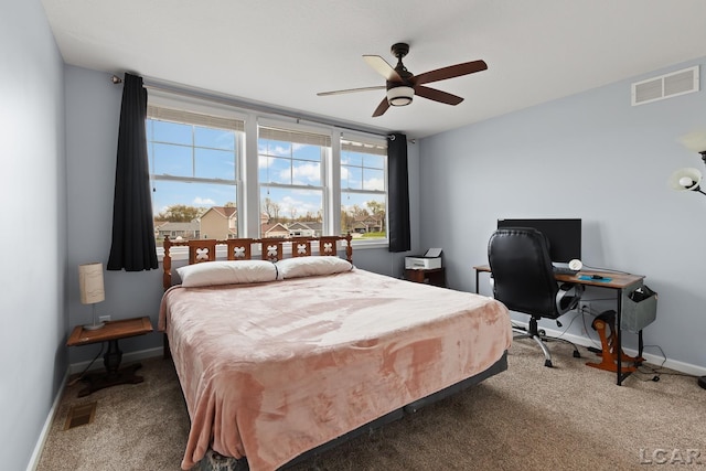 bedroom with baseboards, ceiling fan, carpet, and visible vents