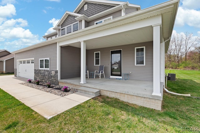exterior space with a porch, a yard, cooling unit, and concrete driveway