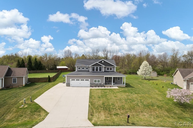 view of front facade featuring covered porch, driveway, and a front lawn