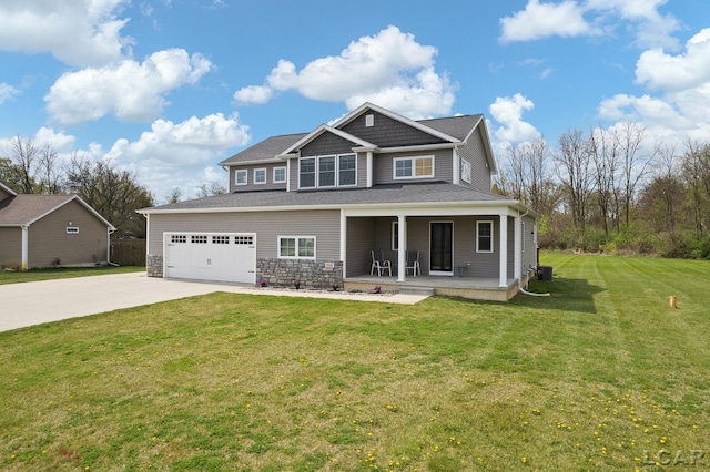 view of front of home featuring a front lawn, covered porch, and driveway