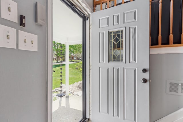 doorway to outside featuring visible vents