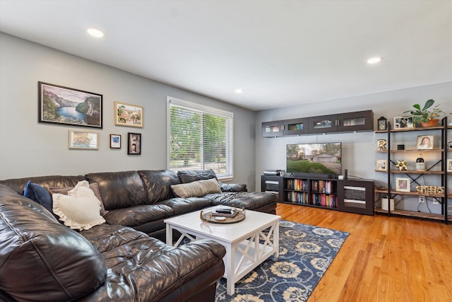 living room with recessed lighting and wood finished floors