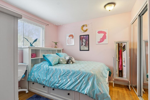 bedroom featuring light wood-type flooring