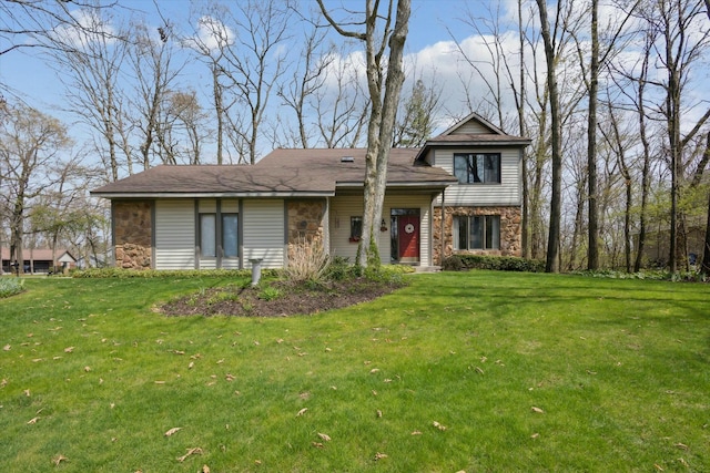 view of front of property with a front yard and stone siding