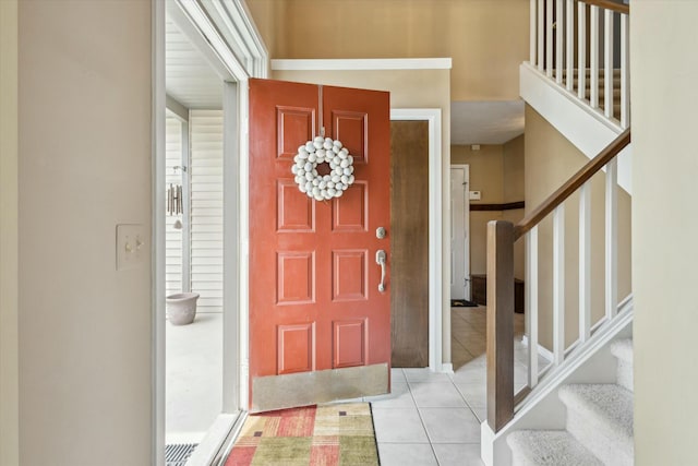 entryway with tile patterned flooring and stairway