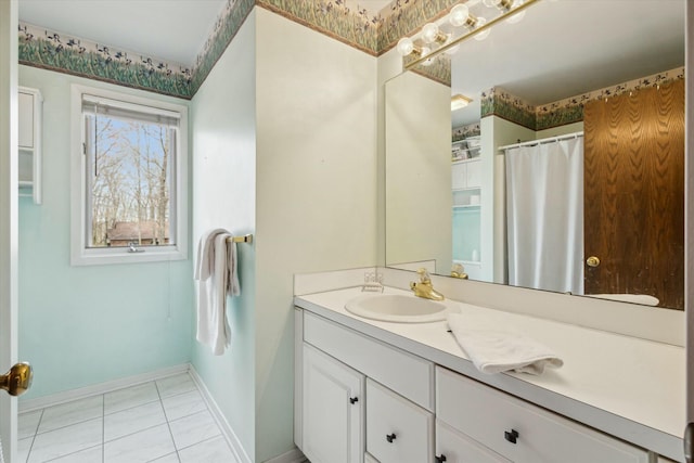 bathroom with a shower with curtain, baseboards, tile patterned floors, and vanity