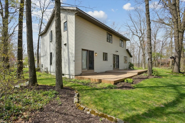back of property featuring a yard and a deck