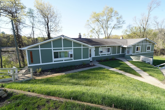 1298 E Highland Rd, Highland, MI 48356 - view of front of home featuring a chimney and a front lawn