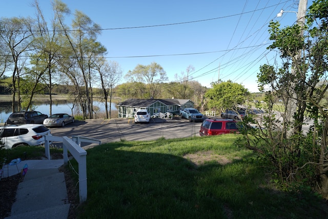 1298 E Highland Rd, Highland, MI 48356 - uncovered parking lot featuring a water view