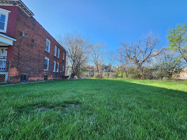 view of yard featuring central air condition unit