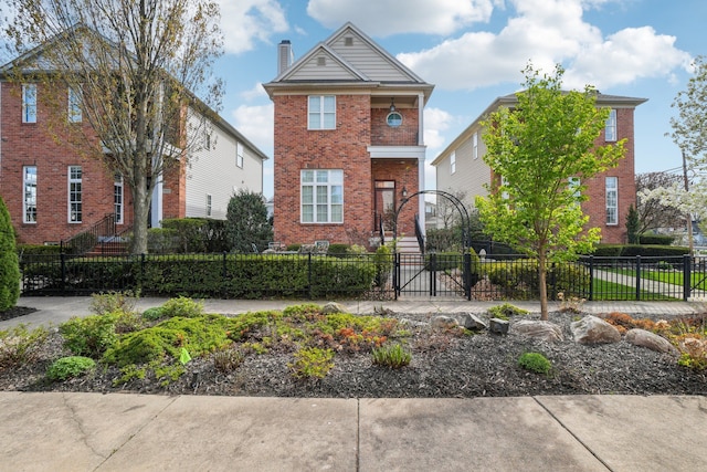 29044 Thistle Ln, Harrison Township, MI 48045 - view of front of property with brick siding, a fenced front yard, and a chimney