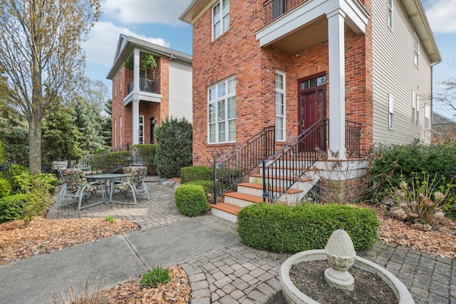 29044 Thistle Ln, Harrison Township, MI 48045 - entrance to property featuring a patio and brick siding
