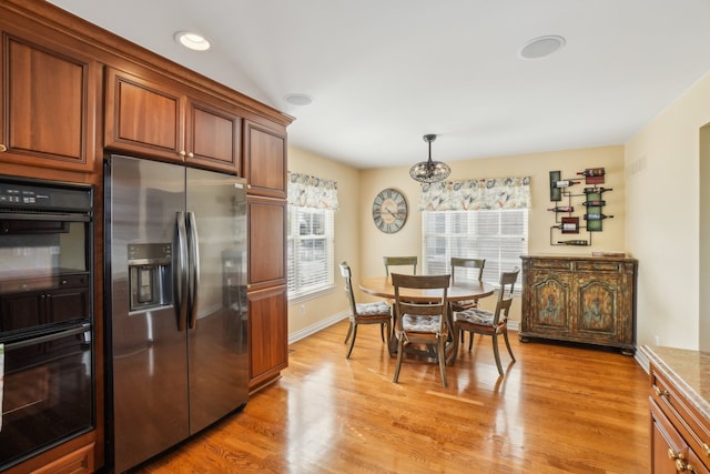 29044 Thistle Ln, Harrison Township, MI 48045 - dining room with baseboards and light wood finished floors