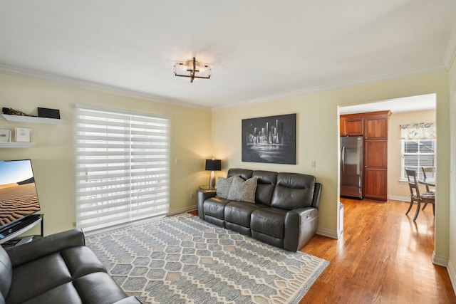 29044 Thistle Ln, Harrison Township, MI 48045 - living area featuring crown molding, baseboards, and light wood-style flooring