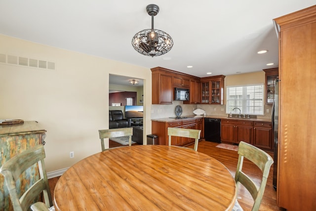 29044 Thistle Ln, Harrison Township, MI 48045 - dining space with recessed lighting, baseboards, visible vents, and wood finished floors