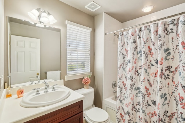 29044 Thistle Ln, Harrison Township, MI 48045 - bathroom featuring vanity, shower / bath combination with curtain, toilet, and visible vents