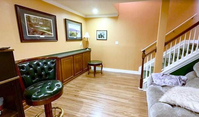 29044 Thistle Ln, Harrison Township, MI 48045 - sitting room featuring crown molding, baseboards, stairs, and light wood-style flooring