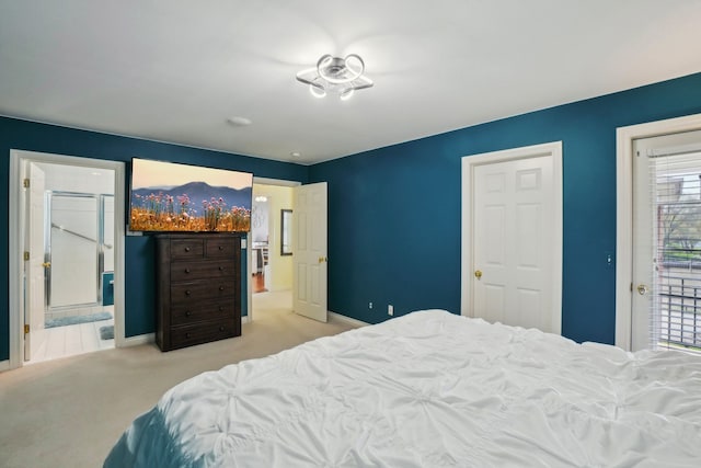 29044 Thistle Ln, Harrison Township, MI 48045 - carpeted bedroom featuring connected bathroom and baseboards