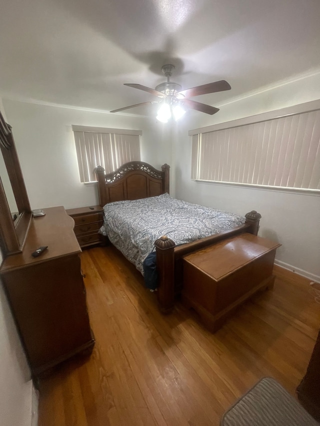 bedroom featuring a ceiling fan and wood finished floors