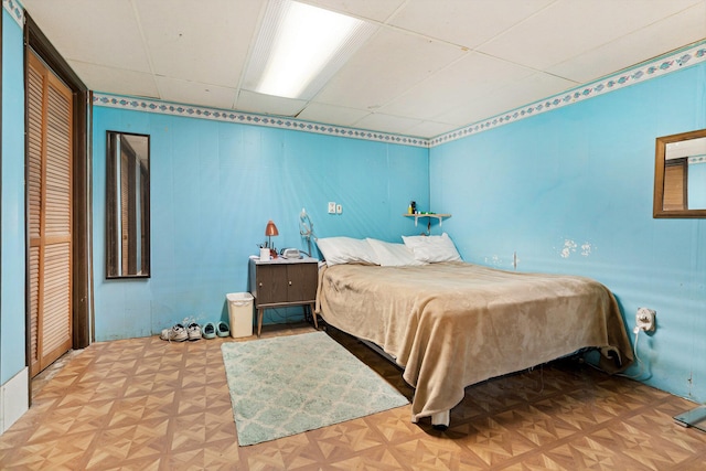 bedroom with a drop ceiling